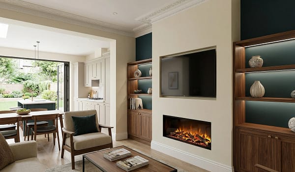 Media wall built into the original chimney breast of a renovated UK Victorian terraced house with TV, electric fireplace, and illuminated walnut shelves.